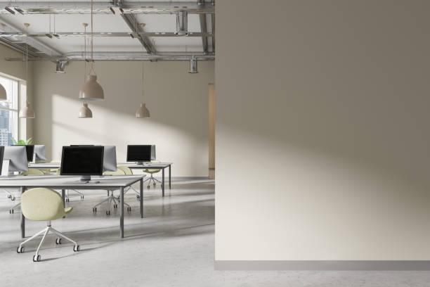 istock Modern office interior with pc monitors and armchairs in row. Mockup wall 2156882941