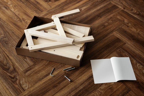 istock Ready-to-assemble chair and instruction book on the floor 2156883955
