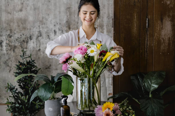 istock Young florist making a beautiful flower arrangement 2156884358