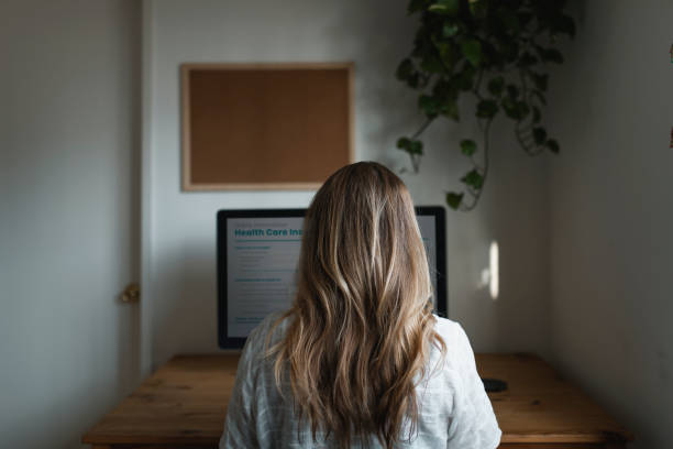 istock Woman working from home during the coronavirus pandemic 2156885524