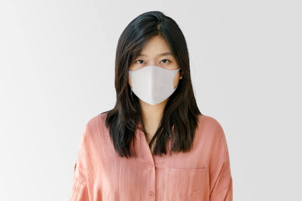 istock Korean woman wearing face mask 2156885650