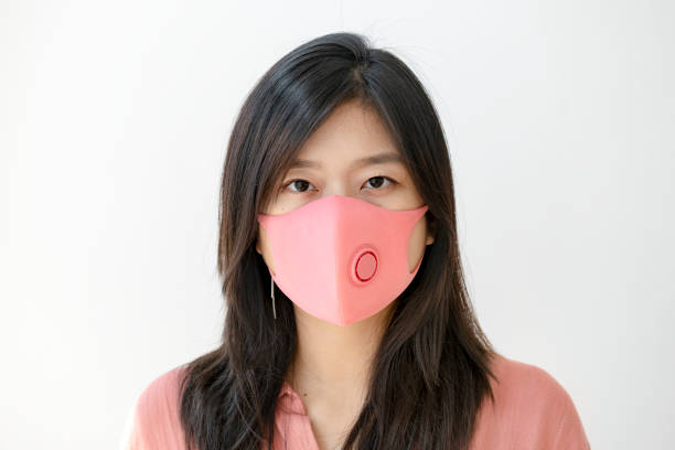 istock Korean woman wearing a face mask 2156885651