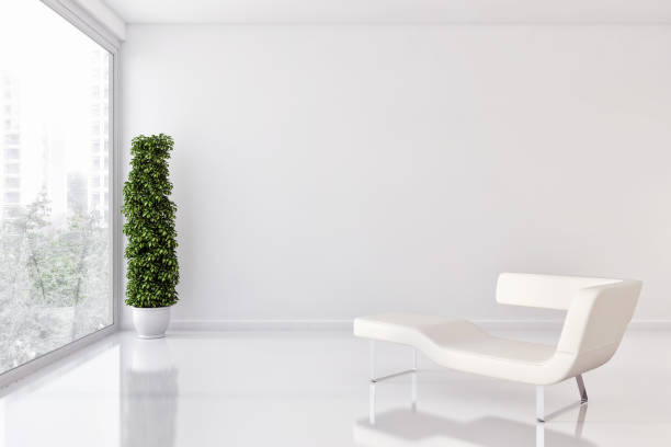 Austere waiting room with two modern chairs.*