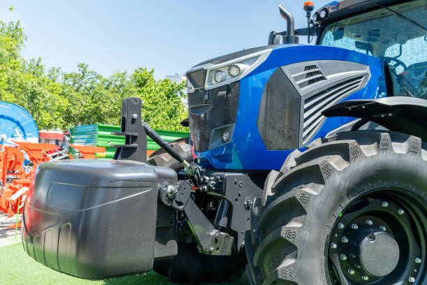 istock Modern blue agricultural tractor on a field. 2156888828