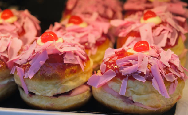 Berliner-style doughnuts, on a display in a pastry shop