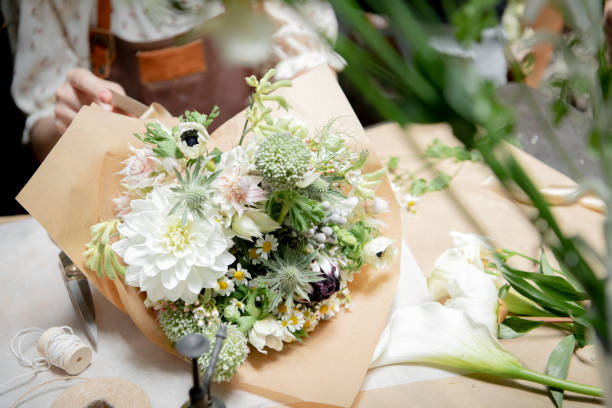 istock Florist making bouquets at a flower shop 2156890550