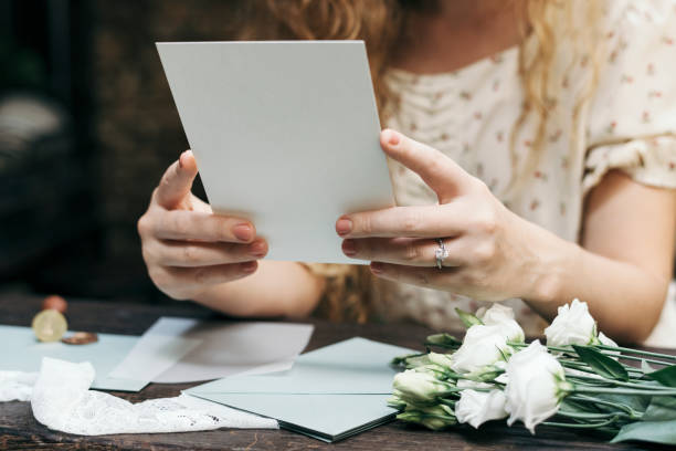 Woman preparing a wedding invitation card