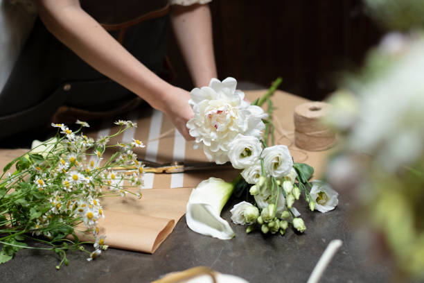 Florist making bouquets at a flower shop