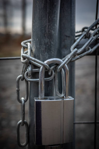 istock the metal lock and the fence 2156892235