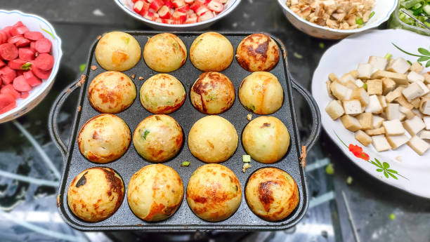 homemade process to cooking takoyaki homemade process to cooking takoyaki most popular delicious snack of japan cooking takoyaki is a ball shaped japanese snack stock pictures, royalty-free photos & images