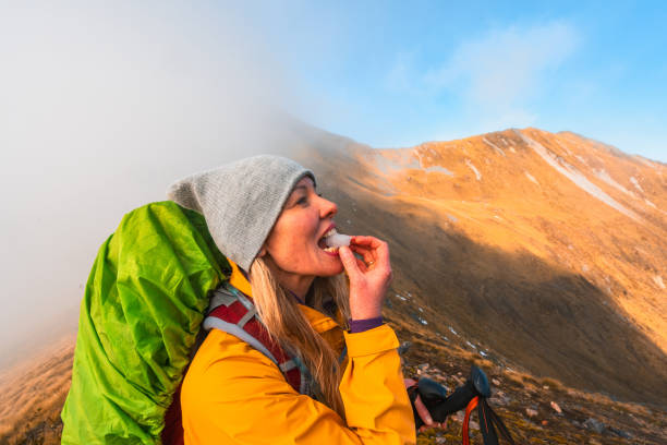 Woman hiking through Kepler Track, Fiordland National Park, South Island, New Zealand.