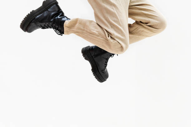 istock Pair of legs jumping into the air 2156893483