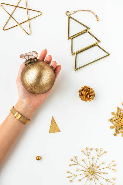 istock Woman holding a gold bauble 2156895544