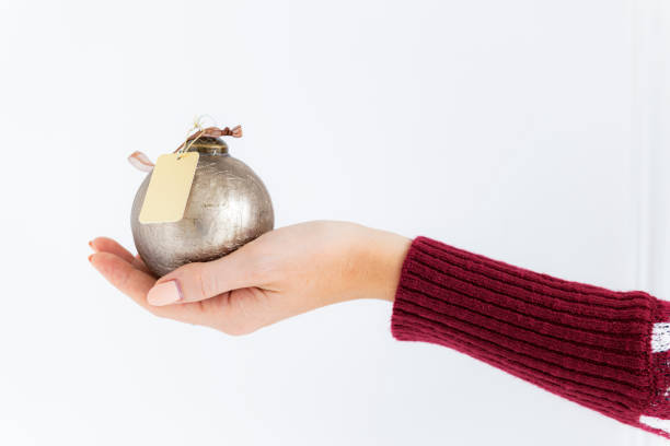 Woman holding a gold bauble
