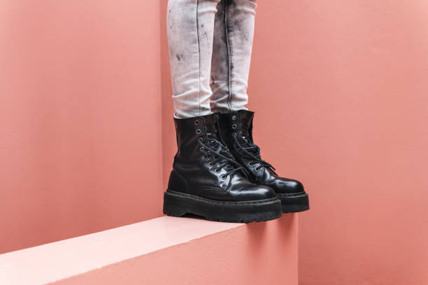 Standing woman wearing combat boots
