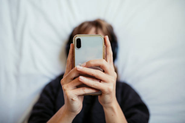 istock Woman listening to music  during coronavirus quarantine 2156896230