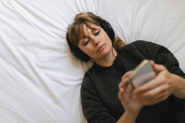 istock Woman listening to music  during coronavirus quarantine 2156896263