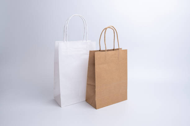 Kraft paper bag on a light background. Delivery and shopping concept. Packaging template mockup