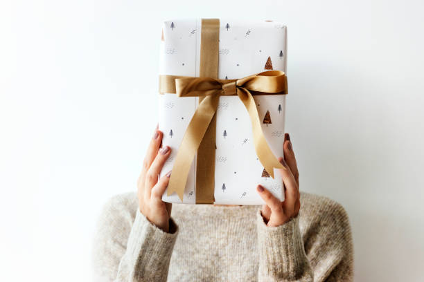 istock Woman covering her face with a white present 2156899149