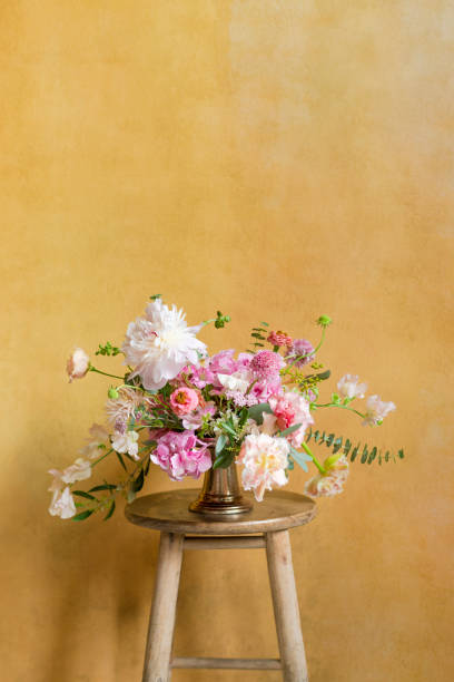 istock Flowers in a vase on a stool 2156900290