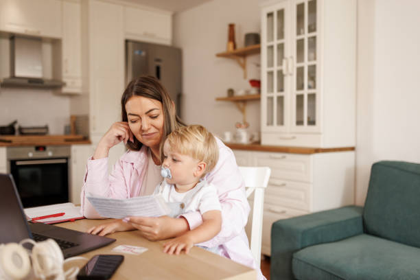 istock Working mother in home office 2156900374