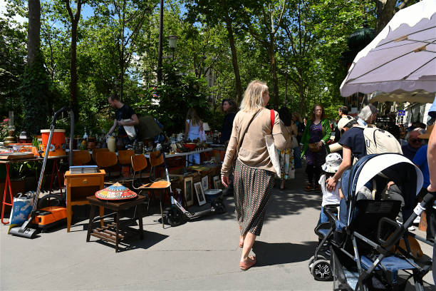 Paris, France-06 09 2024: Bargain hunters at a neighborhood flea market in Paris, France.