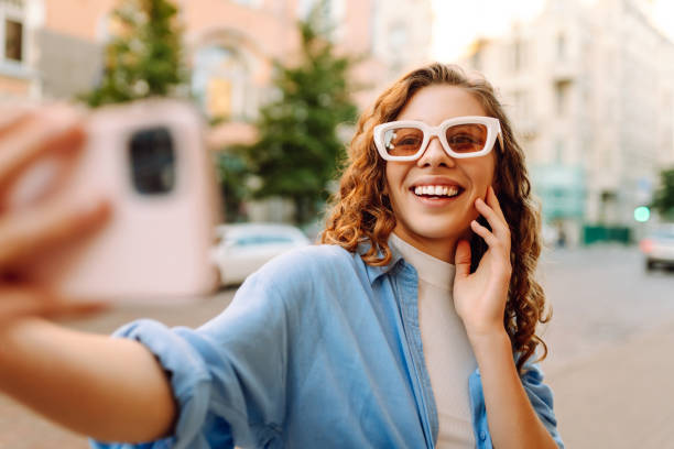istock Carefree model posing in the street at sunset. 2156901229