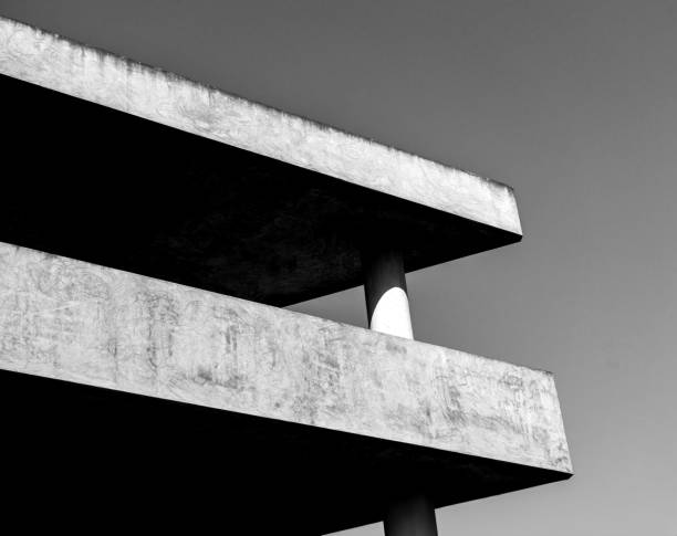 Closeup top part of brand new modern apartment building, white background with copy space, full frame horizontal composition, Sydney Australia