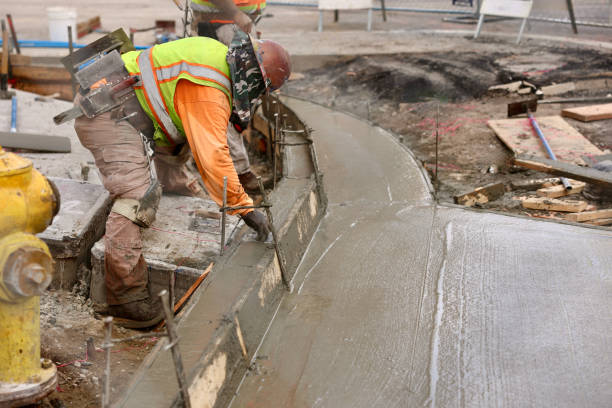 istock Road crew pouring fresh concrete 2156903526