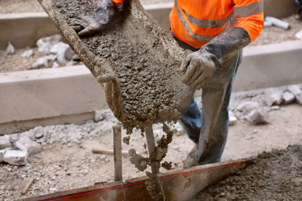 Road crew pouring fresh concrete