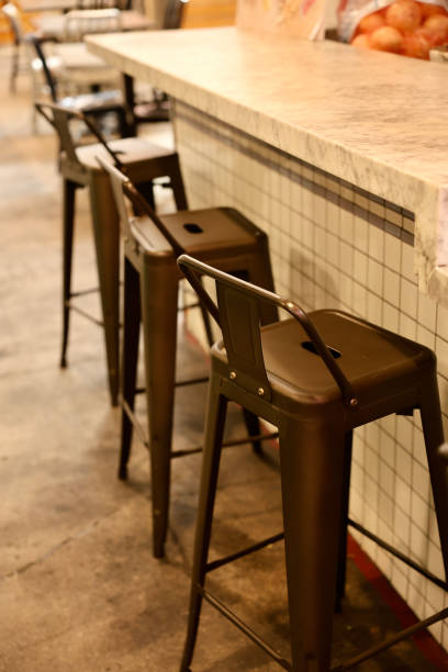 istock Old fashioned farmhouse metal bar stools 2156904999