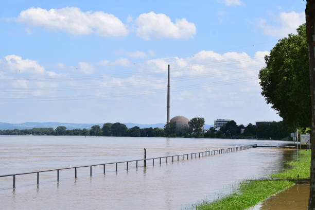 flooded waterfront with a nuclear plant in background