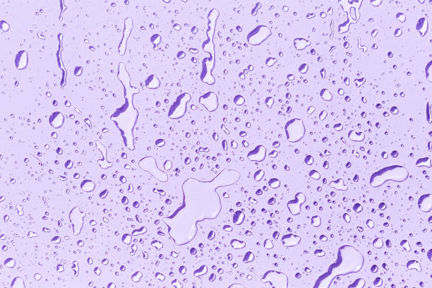 istock Water drops on purple background 2156905897