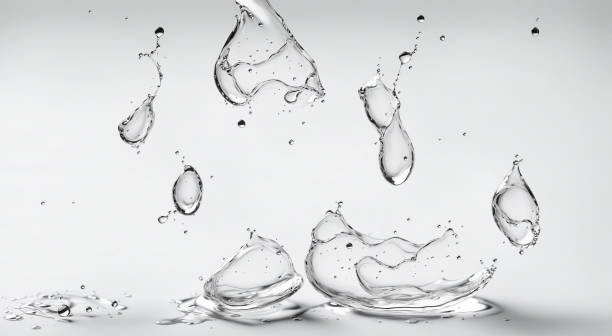 istock Water droplets frozen in mid-air, splash patterns against white background, intricate patterns and textures of water in motion. 3d render 2156906376
