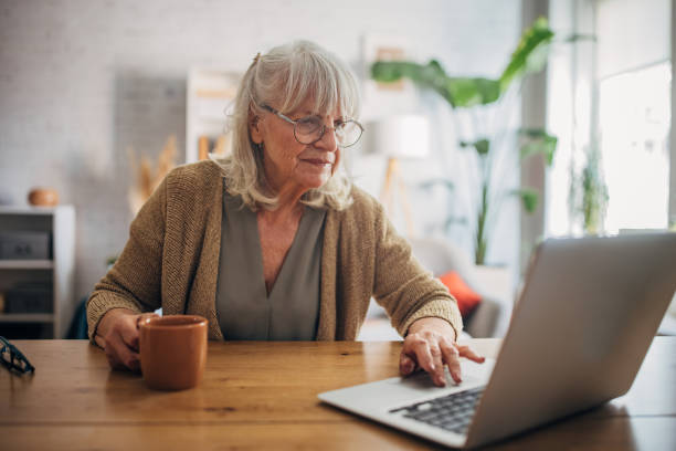 istock Senior white woman using a laptop 2156907165