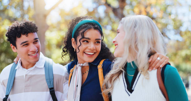 istock Students, campus and happy friends in university park with conversation and study talk outdoor. Education, learning and young people with backpack, morning and commute to class, college and school 2156907528
