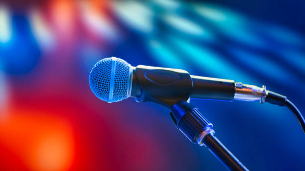 istock Microphone on the stage at the concert in the evening 2156910774