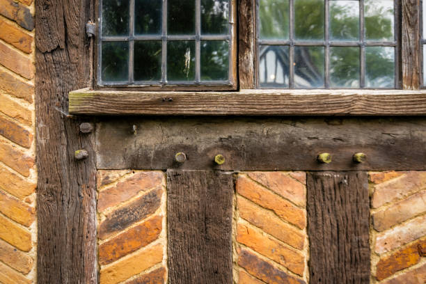 Tudor lead window detail and brick wall