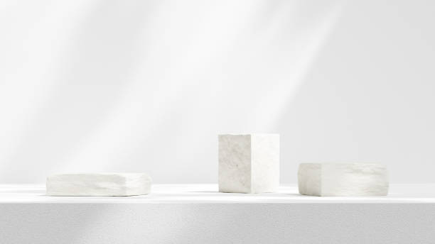 istock Background empty podium display made white cement plinth and leaf for showcasing merchandise in landscape 2156911866