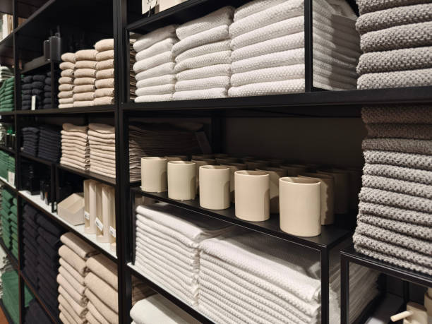 istock A stack of white towels neatly arranged on a black shelf 2156913270