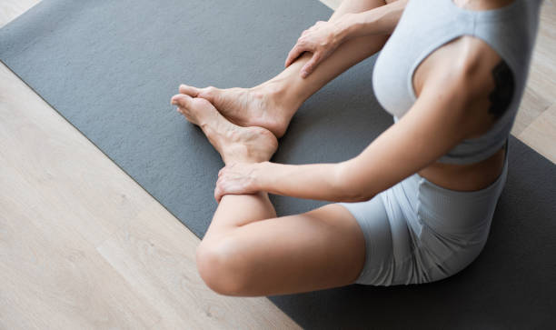 istock Woman practicing yoga, doing relaxation exercises, meditating at class 2156913855