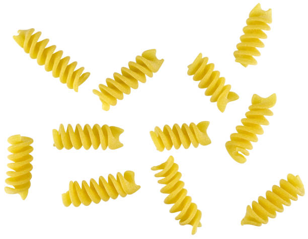 istock Scattered spiral shaped Italian Pasta isolated on a white background. 2156916604