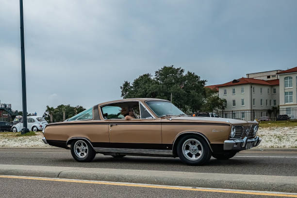 Gulfport, MS - October 05, 2023: Wide angle side view of a 1966 Plymouth Barracuda Hardtop Coupe at a local car show.