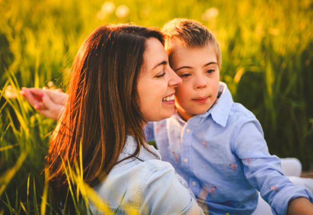 istock Nice mother and child Playing on great field at Sunset 2156921812
