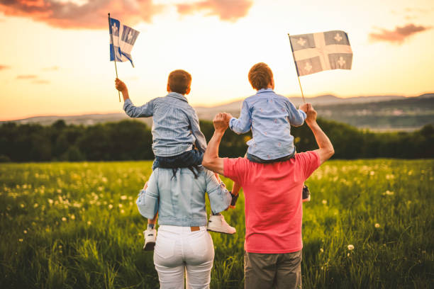 istock A Patriotic family waving Quebec flags on sunset 2156921868