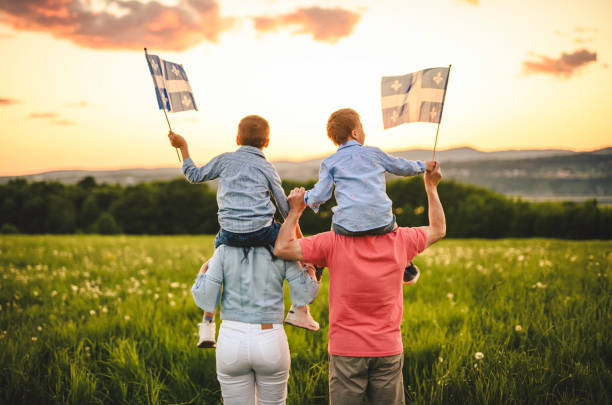 istock A Patriotic family waving Quebec flags on sunset 2156921913