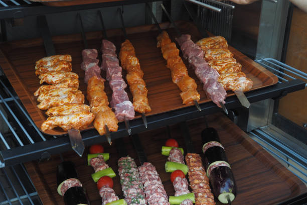 A tray of kebabs with meat and veggies a delicious dish on the table