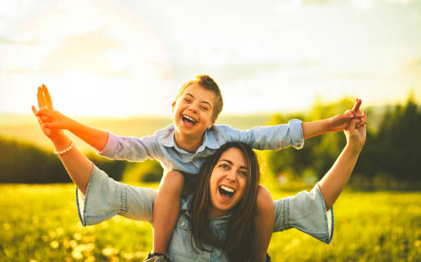 istock Nice mother and child Playing on great field at Sunset 2156922259
