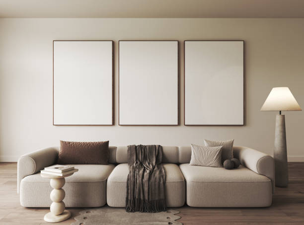 istock Modern sofa in minimalist living room with blank frames on wall, creating clean and elegant space 2156922406