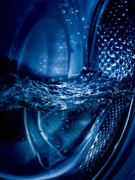 istock Close-up of a washing machine drum with water. 2156922831